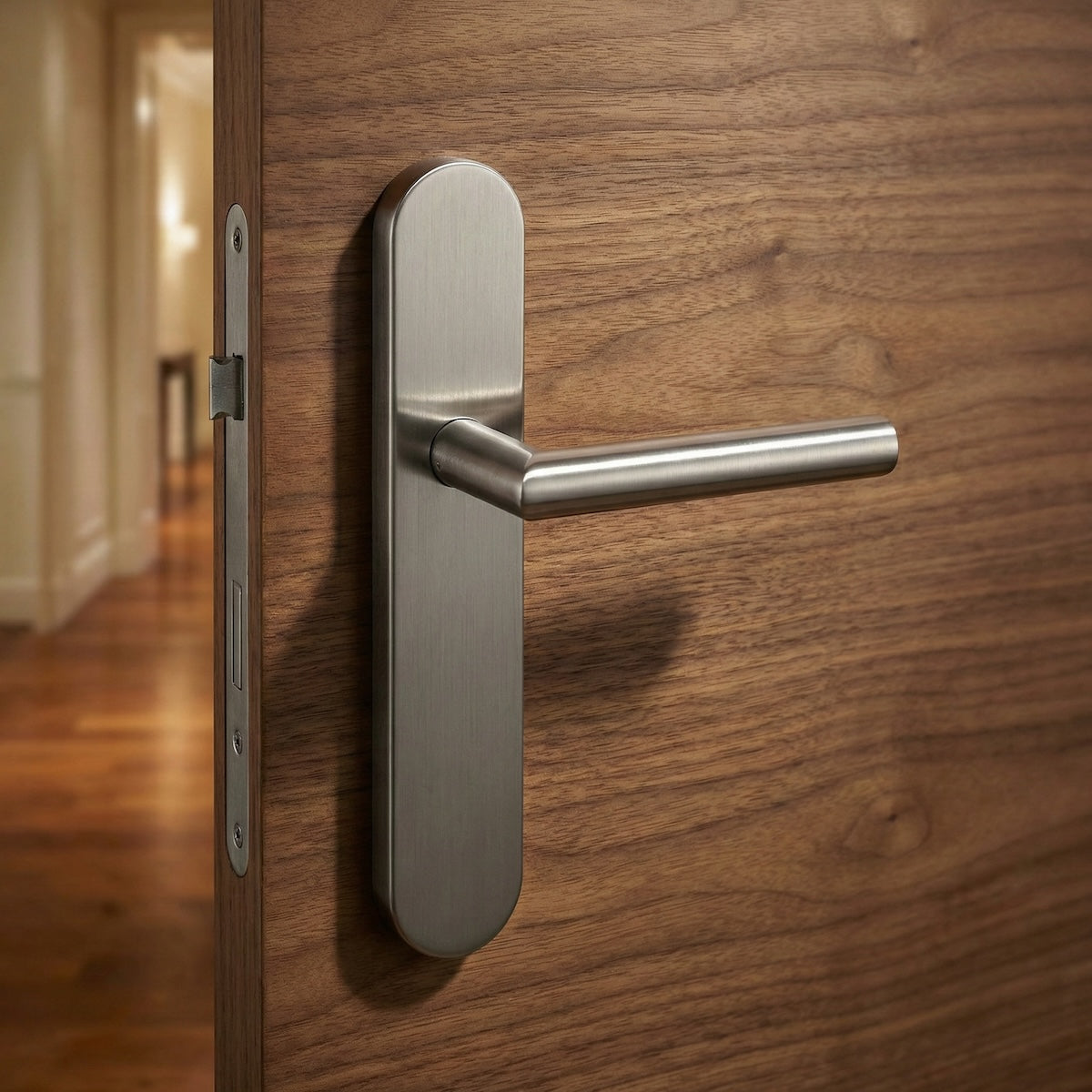 Manilla de acero inoxidable con placa ovalada y tornillos ocultos para puertas modelo '503'