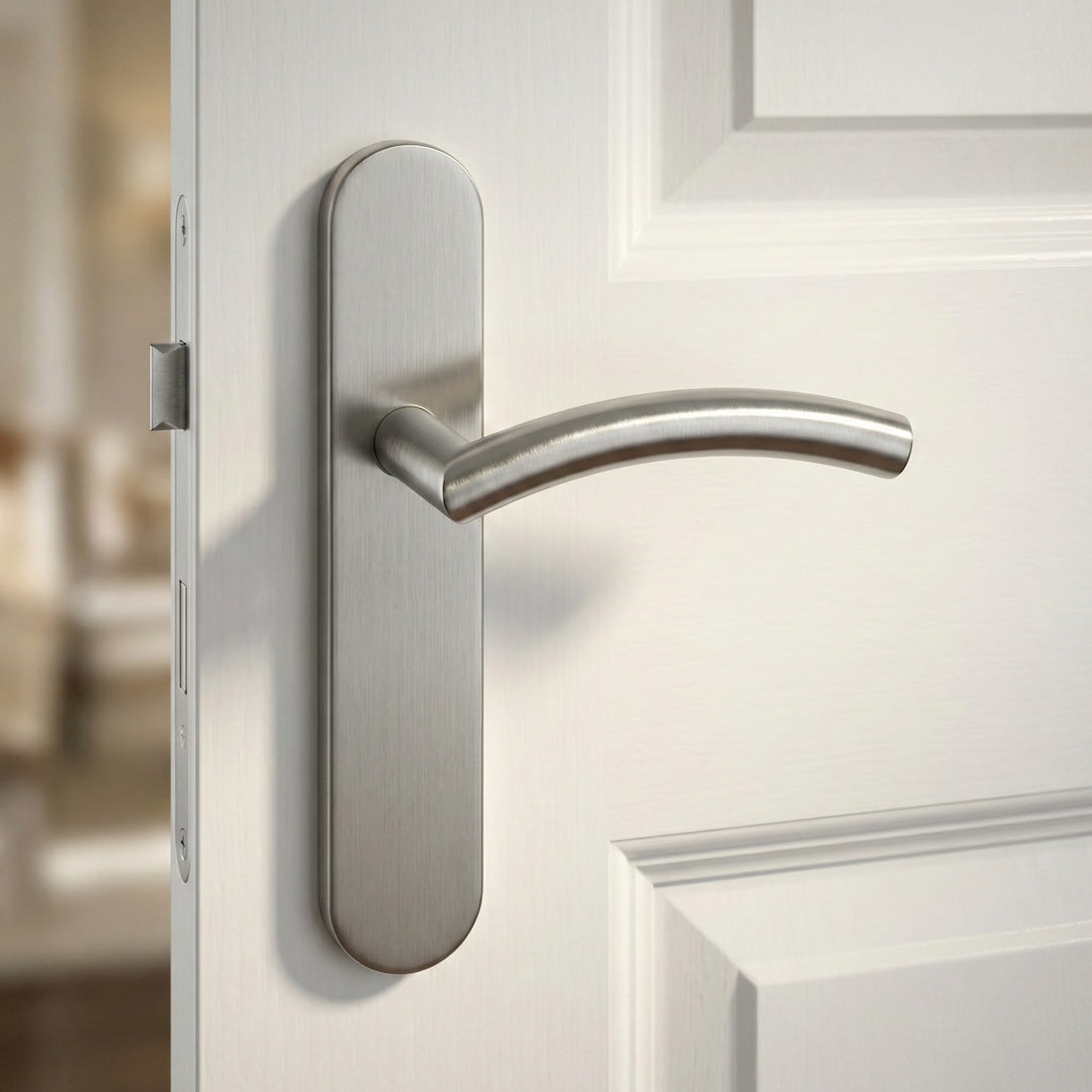 Manilla modelo '703' de acero inoxidable con placa ovalada y tornillos ocultos para puertas